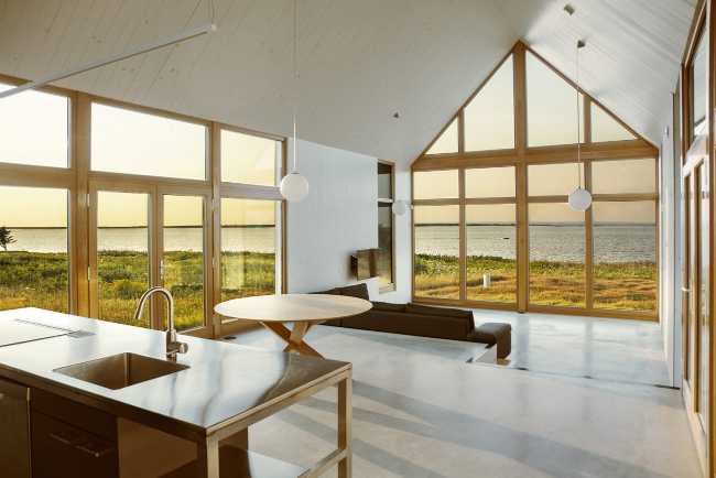 Interior of a wooden house with panorama outside